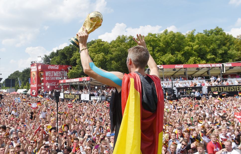 Schweinsteiger showed off the World Cup trophy in Berlin as Germany celebrated winning 2014 tournament in Brazil. 