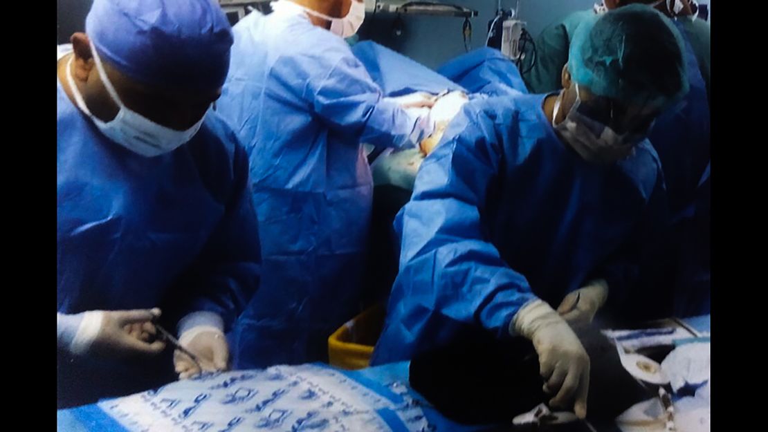 Surgeons -- who cannot be named to protect their identity -- perform surgery.