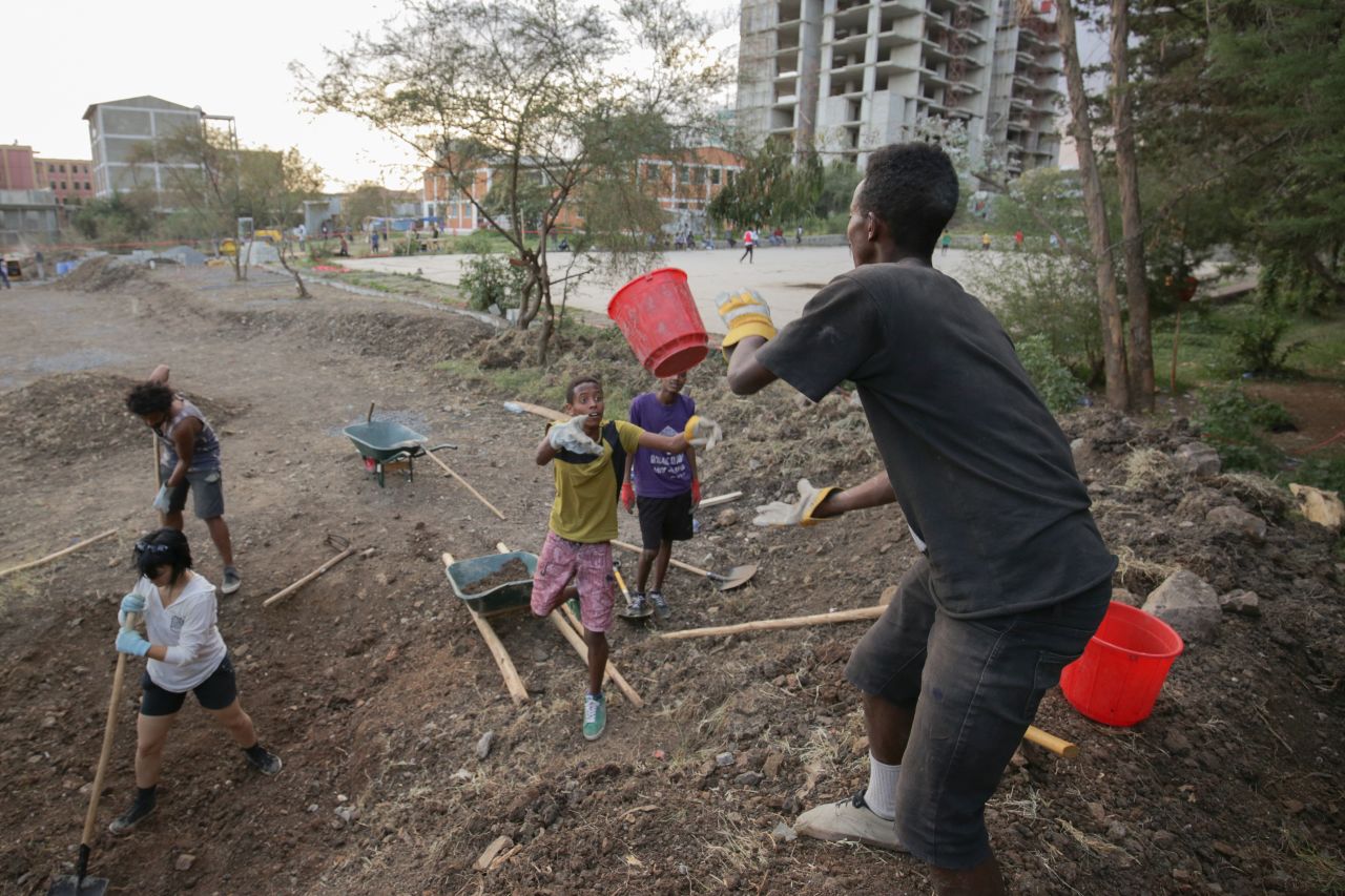 Pictured here, local kids help with the construction of the new skate park.