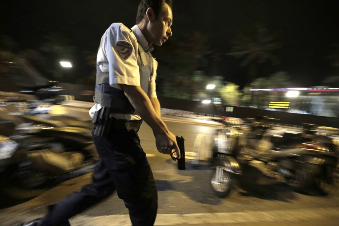 Police secure an area in Nice, France, where a man carried out an attack on people, shooting at a crowd and ramming into them with a truck .