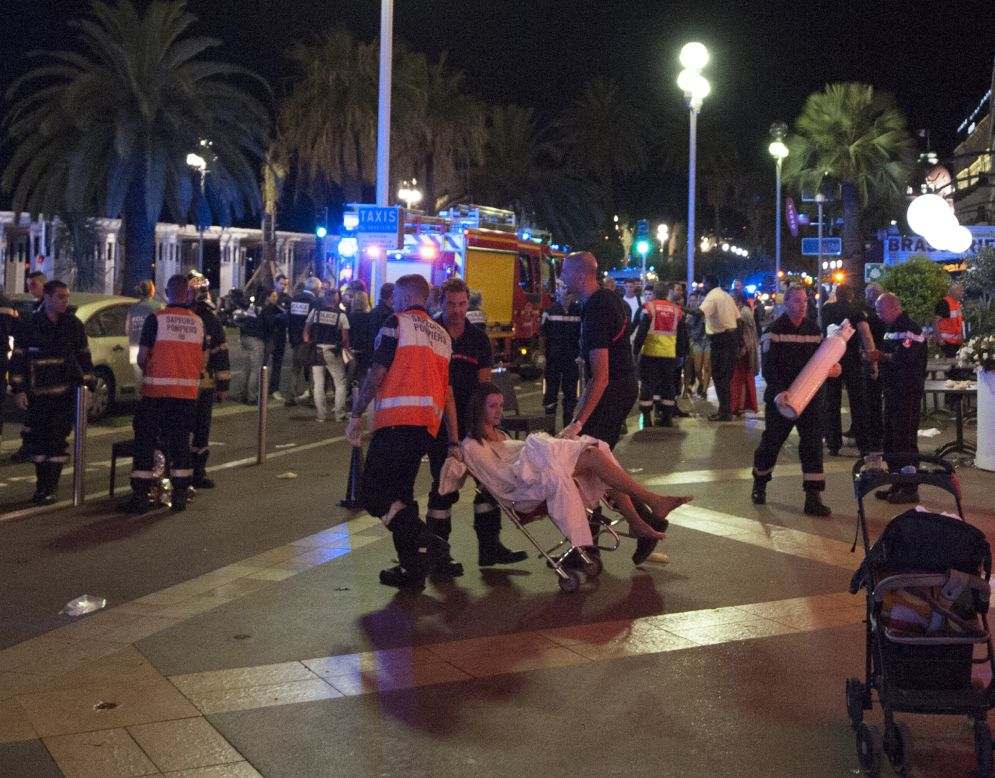 Medical workers attend to an injured woman. 
