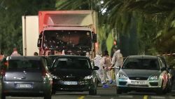 The truck which slammed into revelers late Thursday, July 14, is seen near the site of an attack in the French resort city of Nice, southern France, Friday, July 15, 2016. The truck loaded with weapons and hand grenades drove onto a sidewalk for more than a mile, plowing through Bastille Day revelers who'd gathered to watch fireworks in the French resort city of Nice late Thursday.  (AP Photo/Luca Bruno)