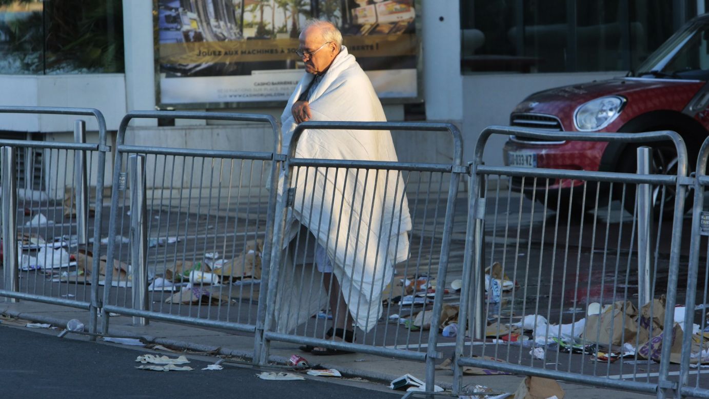 A man looks at the scene of the attack on the Promenade des Anglais.