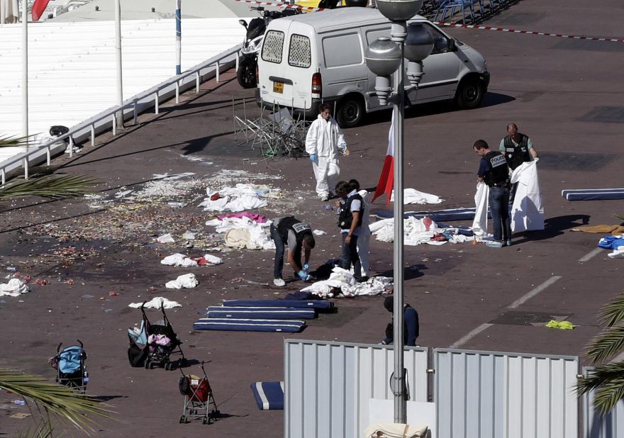 A forensics team inspects the scene of the attack.