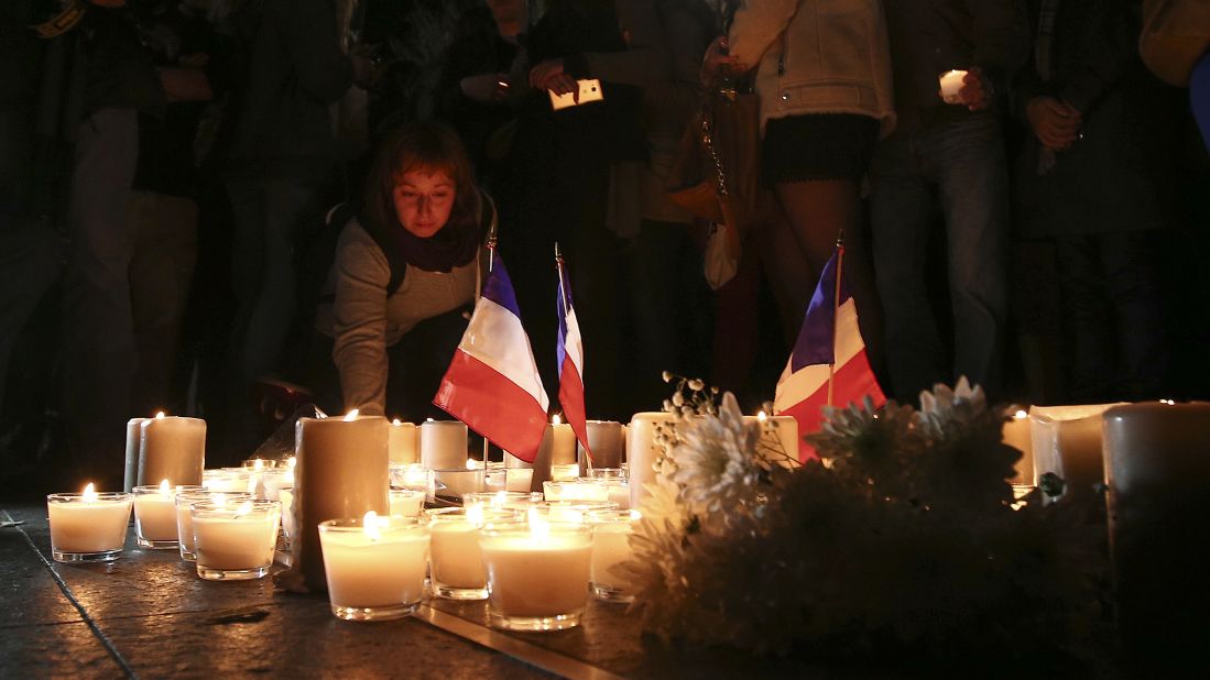 A woman attends a vigil in Sydney on Friday, July 15.