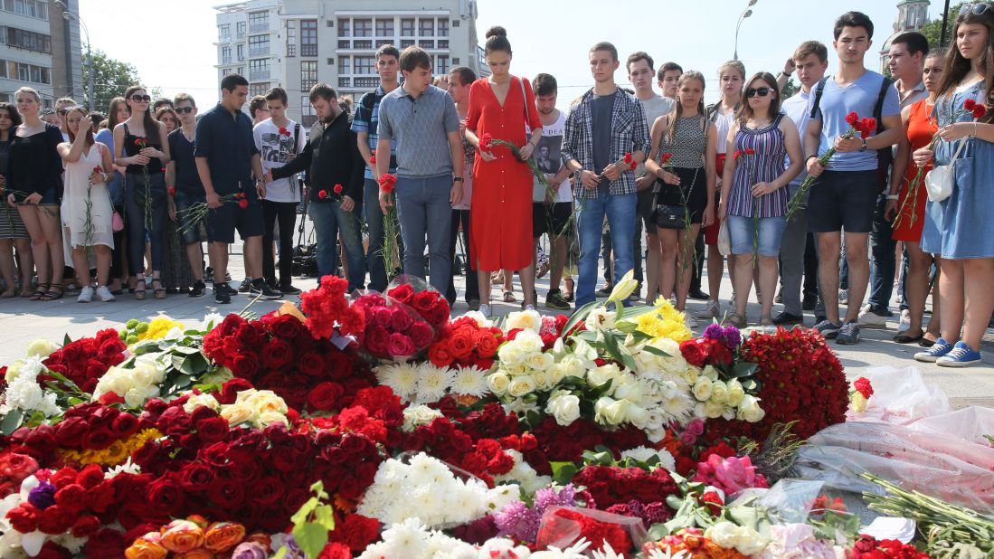 Flowers outside the French Embassy in Moscow commemorate the attack victims.