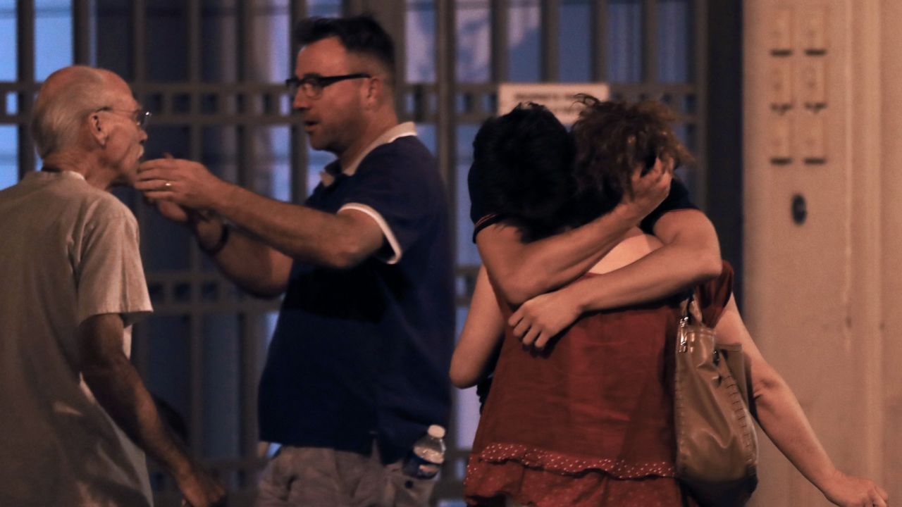 People in the French towon of Nice comfort each other after an attack taht killed at least 84 people. 