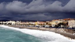 Waves break on the beach below the "Promenade des Anglais" as clouds gather above the French Riviera city of Nice on March 5, 2016.   / AFP / VALERY HACHE        (Photo credit should read VALERY HACHE/AFP/Getty Images)