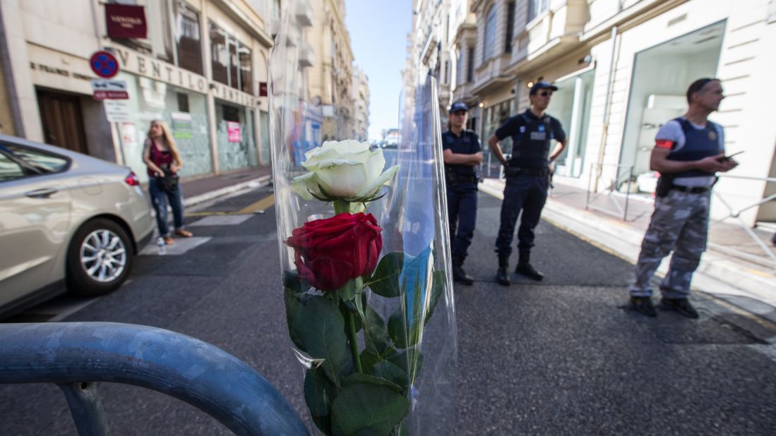 Security personnel stand guard near Nice's Promenade des Anglais.