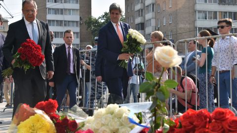 Russian Foreign Minister Sergei Lavrov and U.S. Secretary of State John Kerry lay flowers outside the French Embassy in Moscow.