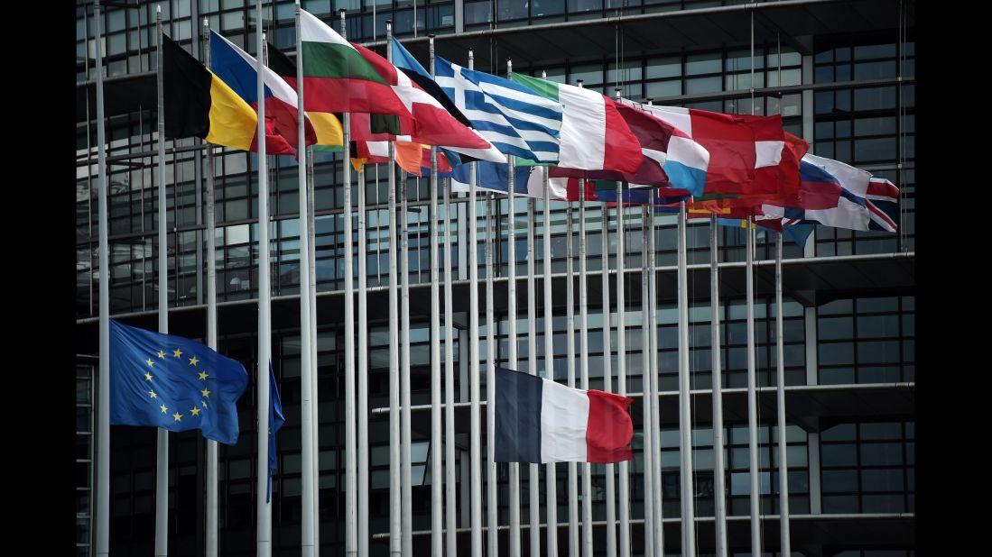 The French and European Union flags fly at half-staff in front of the European Parliament building in Strasbourg, France.