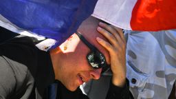 A man reacts as people visit the scene and lay tributes to the victims of a terror attack on the Promenade des Anglais on Friday July 15 in Nice, France.