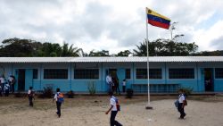 Venezuelan boys and girls from different native ethnic groups, are pictured at the Esperanza multi-ethnical school in Puerto Ayacucho, in the Venezuelan state of Amazonas, on October 24, 2013. Children from the three ethnic groups attending the Esperanza school, are tought in Spanish.   AFP PHOTO/Leo RAMIREZ        (Photo credit should read LEO RAMIREZ/AFP/Getty Images)