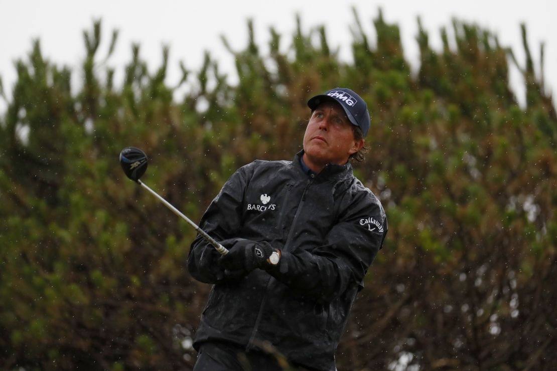 Mickelson caught the worst of the morning rain after a dry, still start.