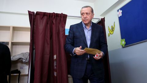 Erdogan leaves a polling booth after casting his vote in Turkey's 26th general election at a polling station in Istanbul on November 1, 2015.