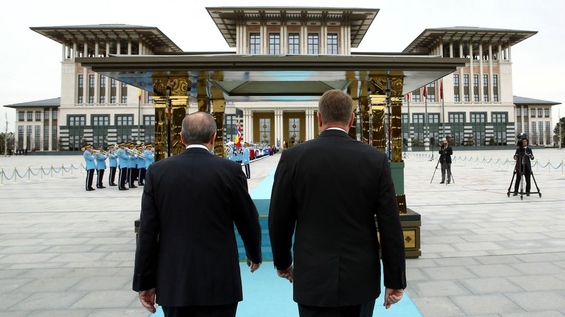 Romanian President Klaus Werner Iohannis, right, and Erdogan walk together during an official welcoming ceremony at the presidential complex in Ankara, Turkey, on Wednesday, March 23.