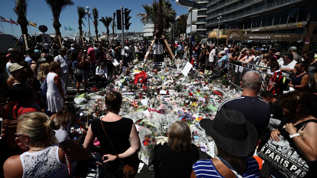  People gather and lay tributes on the Promenade des Anglais on July 16, 2016 in Nice, France. 