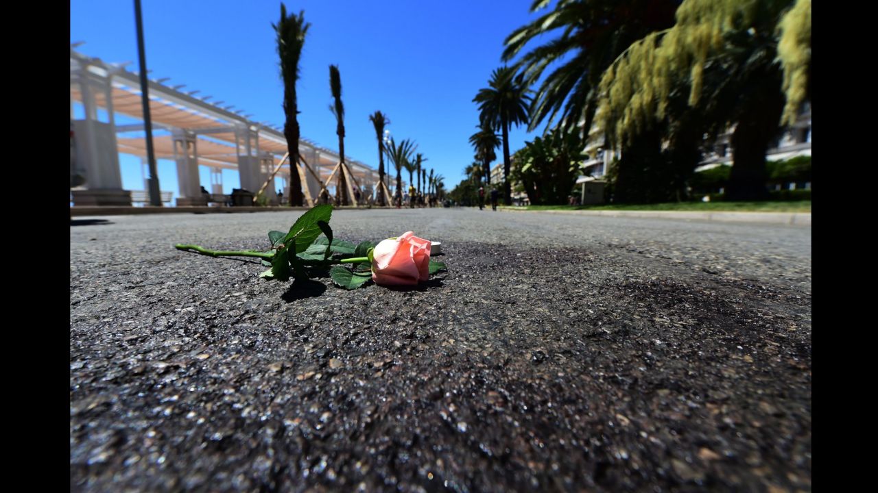 A flower was laid on a blood mark of one of the victims of the deadly Bastille Day attack in the Promenade des Anglais in Nice.