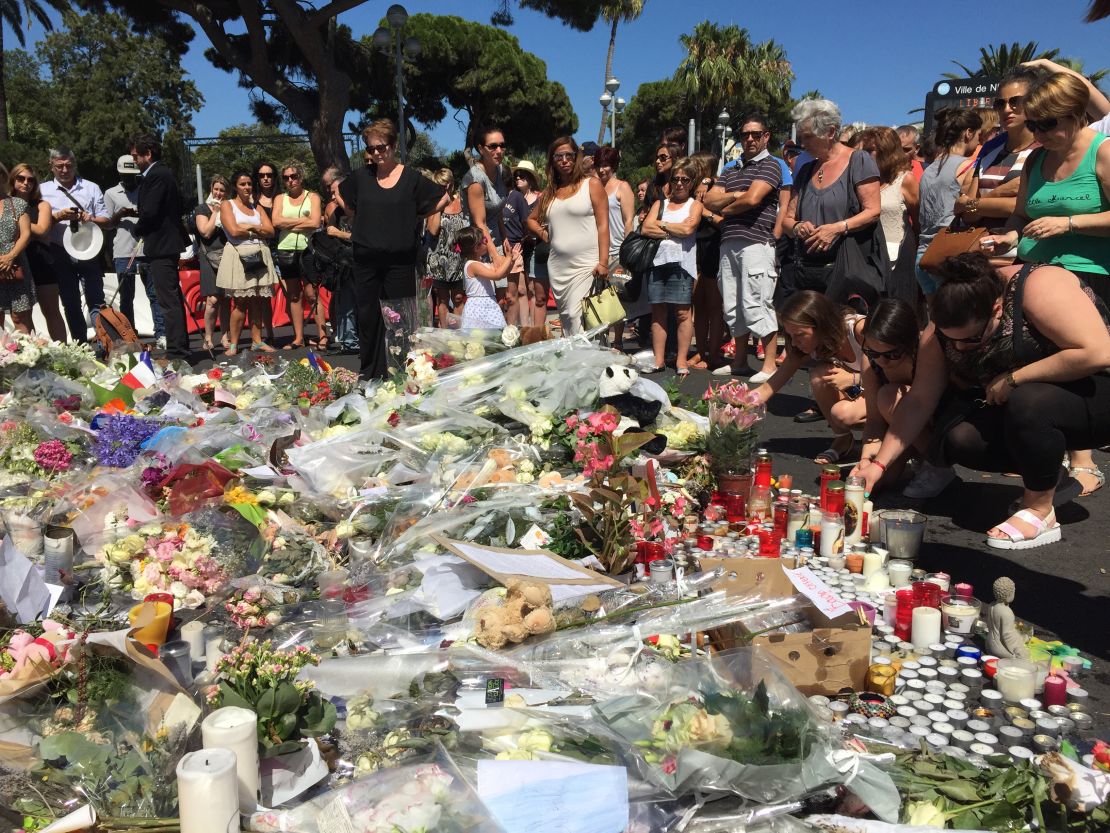 People left flowers, candles and other tributes in Nice, France, on Saturday in memory of those killed in Thursday's terror attack in the coastal city.