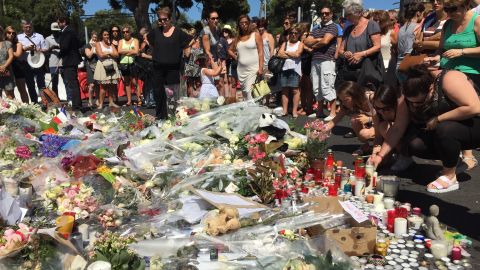 People left flowers, candles and other tributes in Nice, France, on Saturday in memory of those killed in Thursday's terror attack in the coastal city.