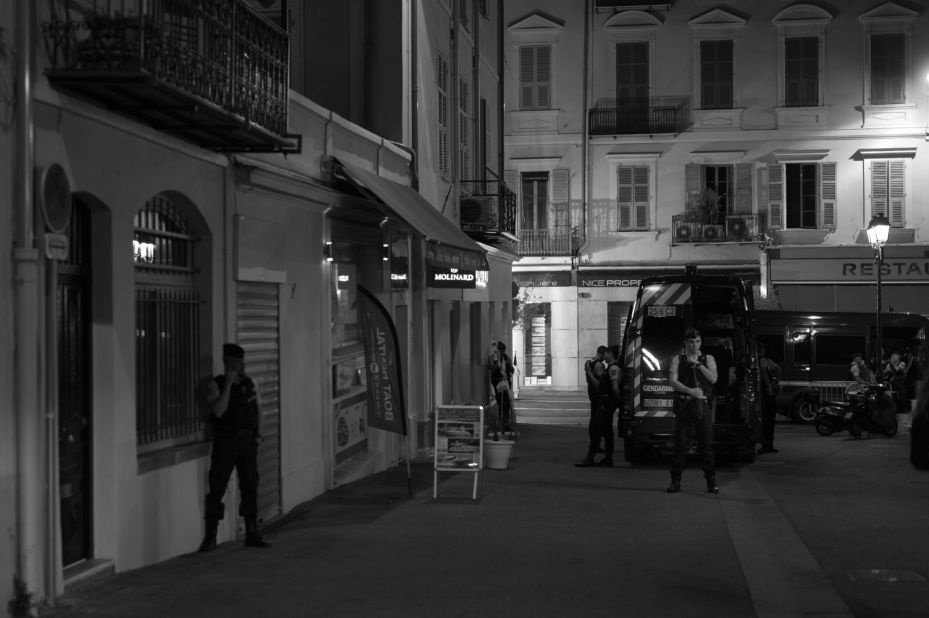 Policemen patrol the streets.