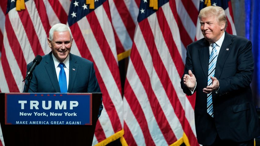 Republican presidential candidate Donald Trump (R) introduces his newly selected vice presidential running mate Mike Pence (L), governor of Indiana, during an event at the Hilton Midtown Hotel, July 16, 2016 in New York City.