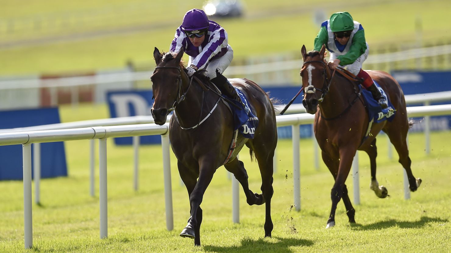 Seventh Heaven, left, with Seamie Heffernan up, pulls clear of Architecture, ridden by Frankie Dettori, to win the Irish Oaks at the Curragh.