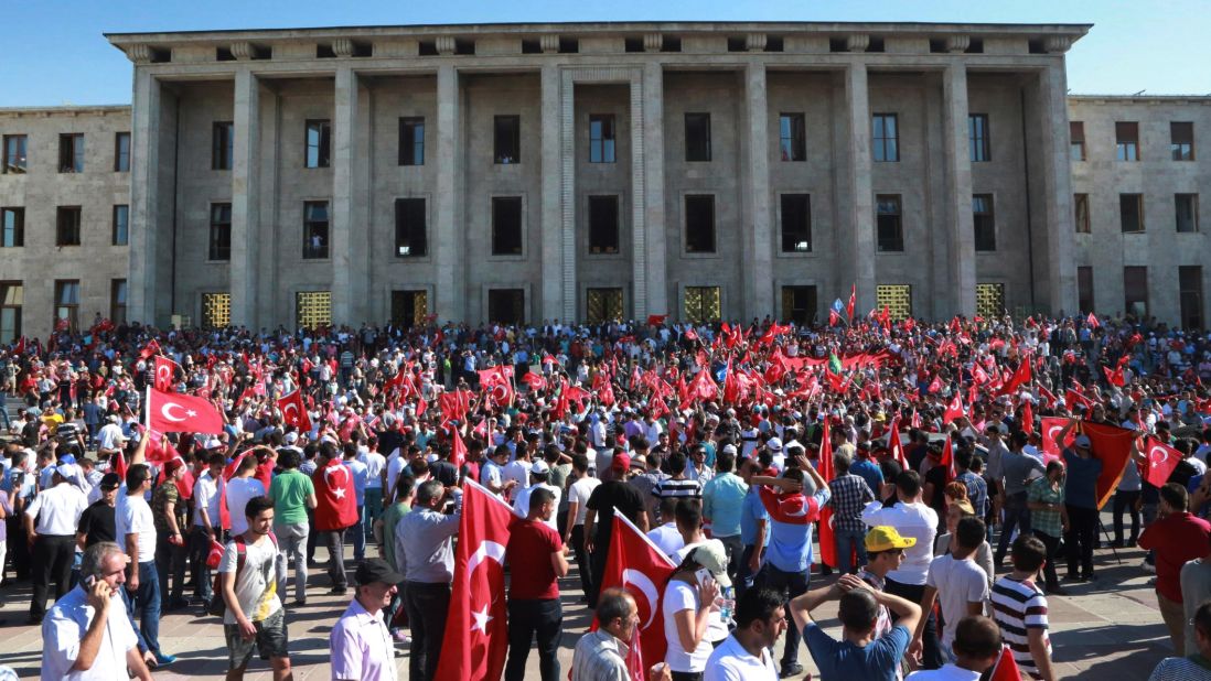 People gather outside the Turkish Parliament  in Ankara during an extraordinary session after the failed coup attempt.