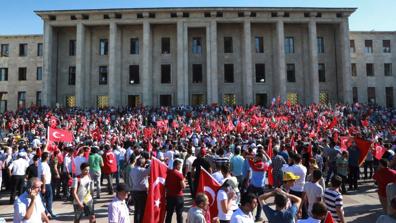 People gather outside the Turkish Parliament  in Ankara during an extraordinary session after the failed coup attempt.
