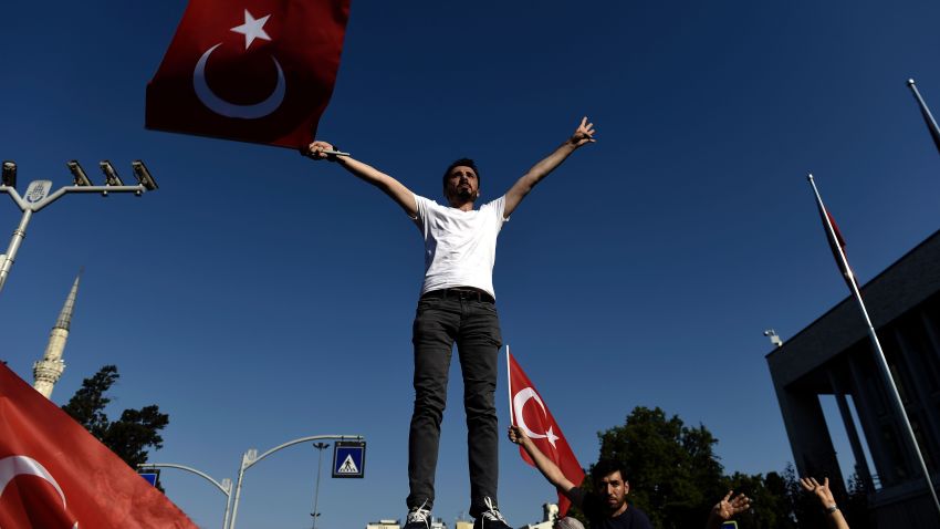 A man waves a Turkish flag during a demonstration in Istanbul in support the government on July 16 following a failed coup attempt.