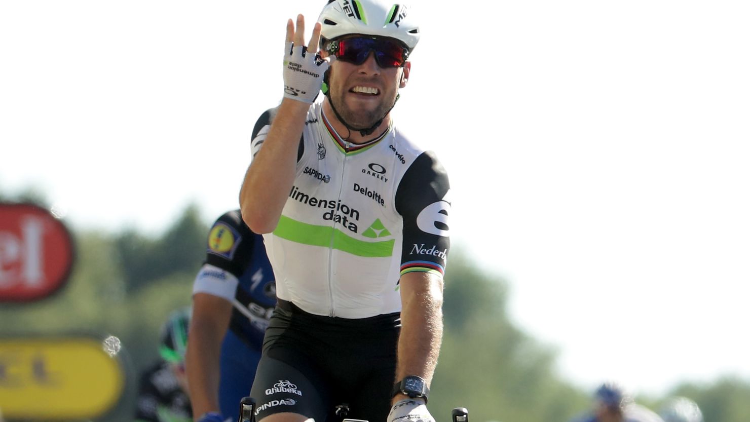 Mark Cavendish holds up four fingers after taking the 14th stage of the Tour de France for Team Dimension Data -- his fourth in this year's race.