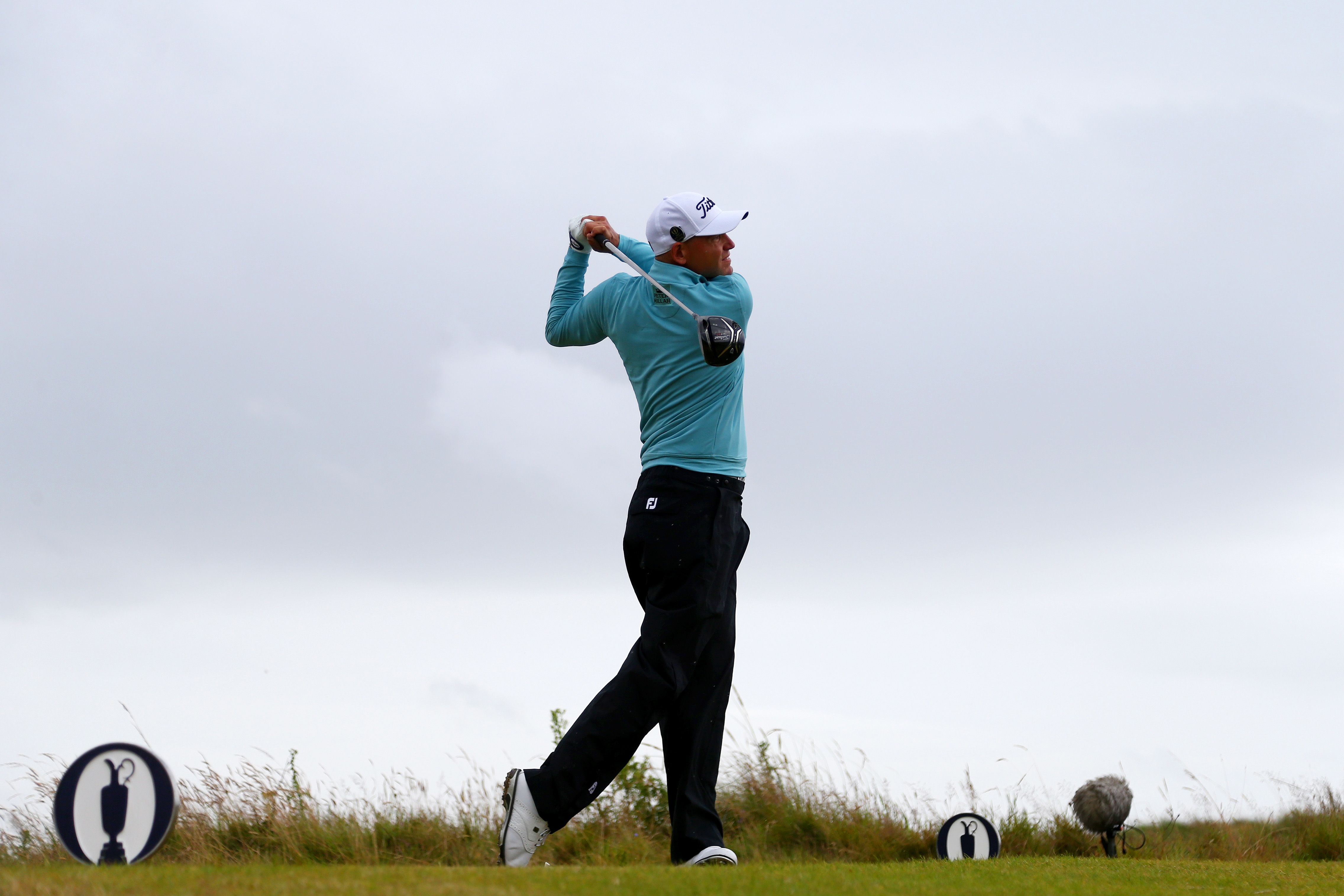 Bill Haas of the United States hits his tee shot on the 13th as he chased the leaders on six-under.