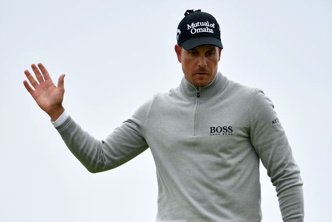 Henrik Stenson of Sweden celebrates his birdie on the 17th at Royal Troon on his way to claiming the third round lead at the British Open.  