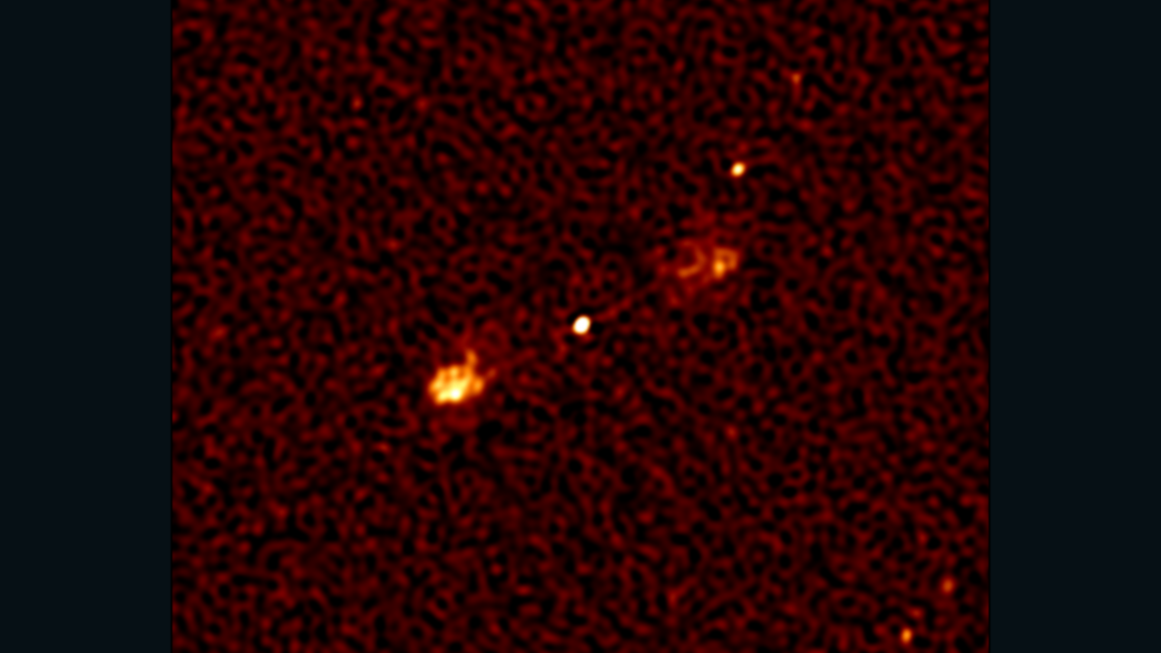 A "Fanaroff-Riley Class 2" (FR2) object: a massive black hole in the distant universe (matter falling into it produces the bright dot at the center) launching jets of powerful electrons moving at close to the speed of light.