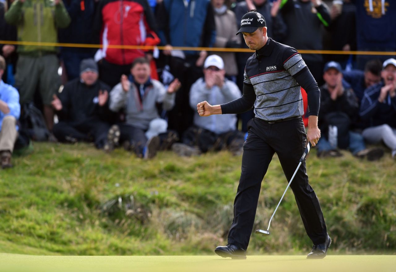 Sweden's Stenson reacts after making his birdie putt on the 14th green during his triumphant final round at the British Open.