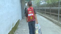 A photo of a Venezuelan child as he walks to school.