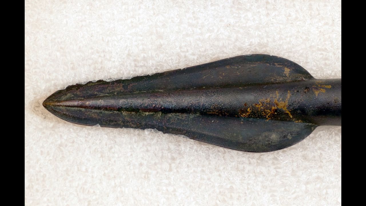 This bronze spear head was discovered with part of its shaft intact. 