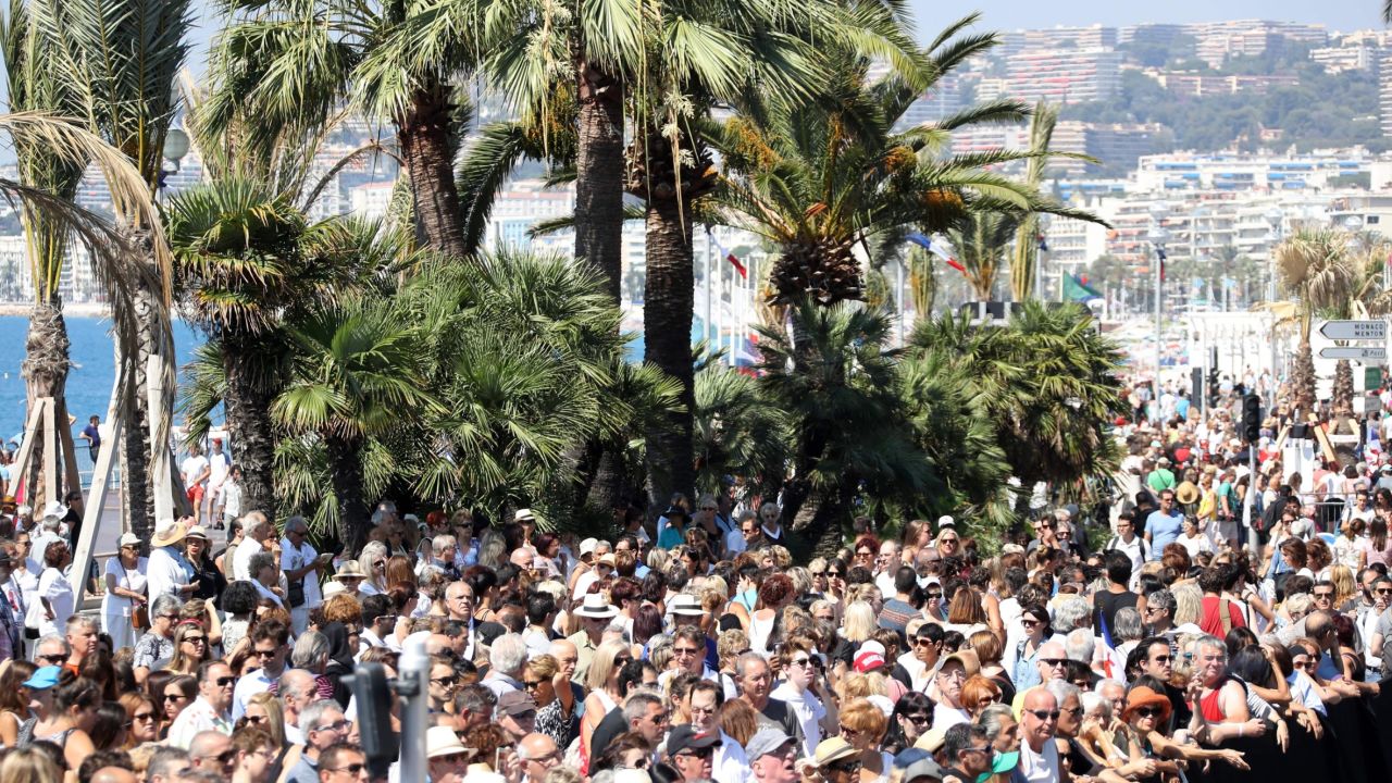 Thousands gather to observe a minute of silence at noon Monday on Nice's Promenade des Anglais. 