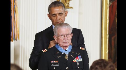 President Barack Obama presents the Medal of Honor to retired Army Lt. Col. Charles Kettles, 86, of Ypsilanti, Michigan, during a ceremony in the East Room of the White House in Washington July 18. Kettles displayed extraordinary daring and bravery when he landed his helicopter in the middle of a battle near Duc Pho, Vietnam to save eight soldiers who had been left behind after an initial rescue mission. He then managed to pilot the severely overloaded helicopter to safety.