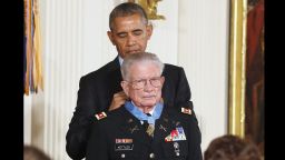 President Barack Obama presents the Medal of Honor to retired Army Lt. Col. Charles Kettles, 86, of Ypsilanti, Michigan, during a ceremony in the East Room of the White House in Washington July 18. Kettles distinguished himself in combat operations near Duc Pho, Vietnam, and is credited with saving the lives of 40 soldiers and four of his own crew members.