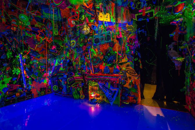 Pop surrealist Kenny Scharf built the first of his "Closets" in New York, 1981 in a loft he shared with Keith Haring. "I made it as a place to go and trip," <a href="index.php?page=&url=http%3A%2F%2Fkennyscharf.com%2Fwp-content%2Fuploads%2F2013%2F10%2FARTNEWS-985-GERALD-MARZORATI.pdf" target="_blank" target="_blank">he explains</a>, recalling a period "when I was really into mushrooms -- doing them maybe once a week." Scharf's "safe space" evolved, becoming a cathedral of Day-Glo bricolage, with over 30 iterations in four decades, from LA to Tokyo. His latest offerings, the Cosmic Cavern at the <a href="index.php?page=&url=http%3A%2F%2Fportlandartmuseum.org%2Fexhibitions%2Fkenny-scharf-cosmic-cavern%2F" target="_blank" target="_blank">Portland Art Museum</a> and the <a href="index.php?page=&url=http%3A%2F%2Fnassaumuseum.org%2Fexhibits_tahari.php" target="_blank" target="_blank">Nassau County Museum of Art</a>, show Scharf's desire to cram as much psychedelic goodness into one space as possible is anything but diminished. 
