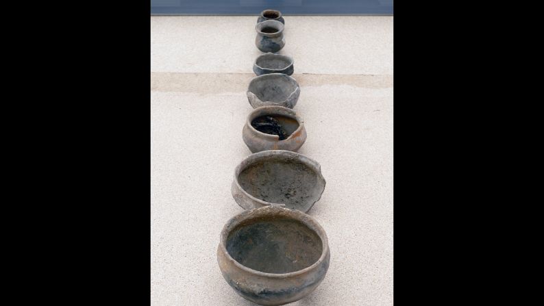The consistent design of these small clay pots suggests they were made by the same potter.