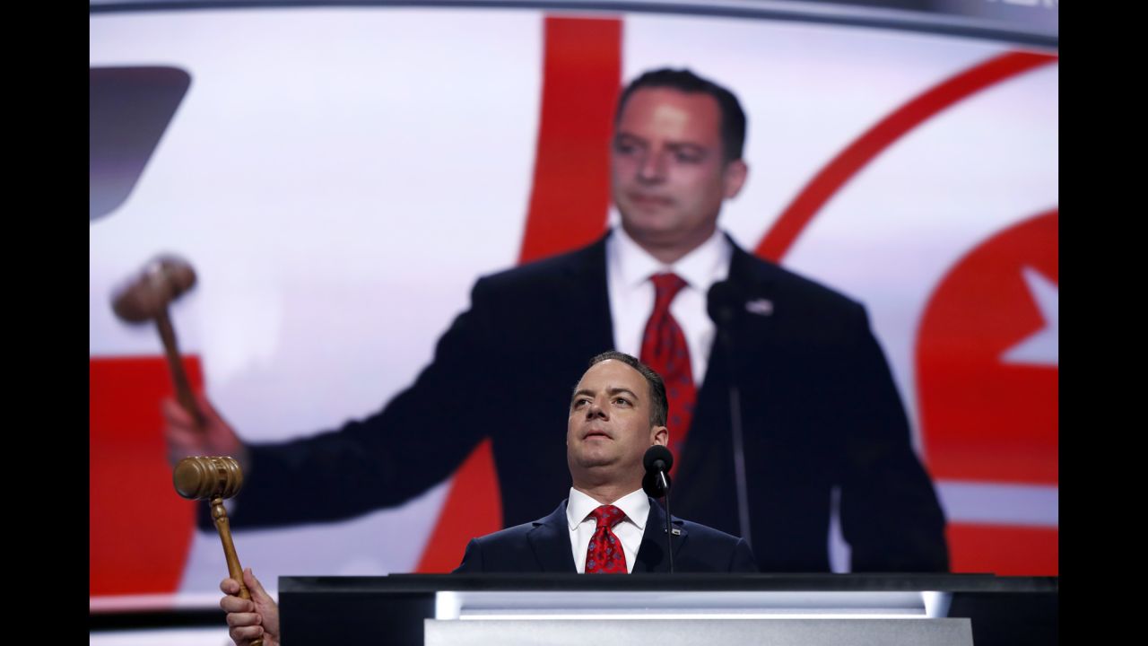 Reince Priebus, chairman of the Republican National Committee, bangs a gavel as resolutions are adopted at the start of the convention.