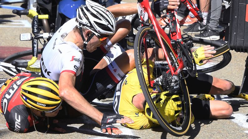 Richie Porte, left, was competing in the 12th stage of the Tour de France when he crashed into a TV motorcycle that slowed down in front of him on Thursday, July 14. The crash also took out Bauke Mollema, center, and overall leader Chris Froome, right.