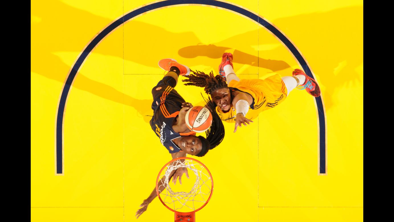 Connecticut's Chiney Ogwumike pulls down a rebound in front of Indiana's Eriana Larkins during a WNBA game in Indianapolis on Wednesday, July 13.