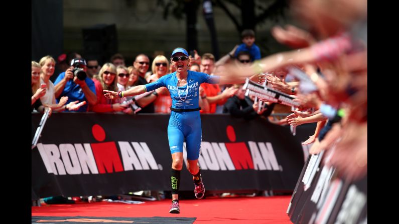 Lucy Gossage crosses the finish line to win the Ironman race in Bolton, England, on Sunday, July 17.