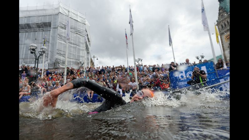 A triathlete in the Mixed Relay World Championship swims in Hamburg, Germany, on Sunday, July 17.