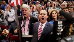 Sen. Mike Lee, (R-UT) (C) and Phill Wright, Vice Chair of the Utah State Delegation (L) shout no to the adoption of rules without a roll call vote on the first day of the Republican National Convention on July 18, 2016 at the Quicken Loans Arena in Cleveland, Ohio. An estimated 50,000 people are expected in Cleveland, including hundreds of protesters and members of the media. The four-day Republican National Convention kicks off on July 18.