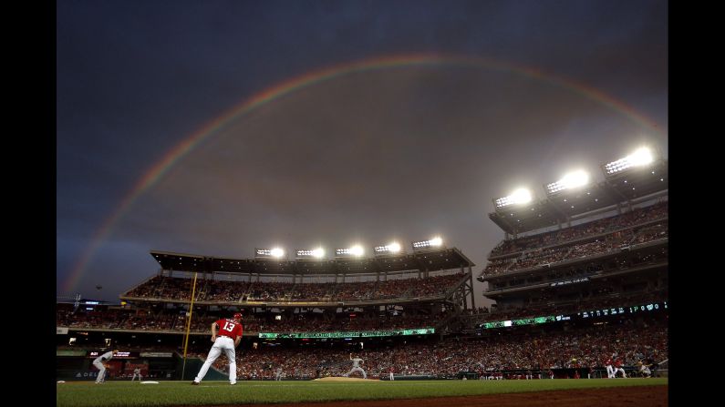 A rainbow appears over Nationals Park during a Major League Baseball game in Washington on Saturday, July 16.