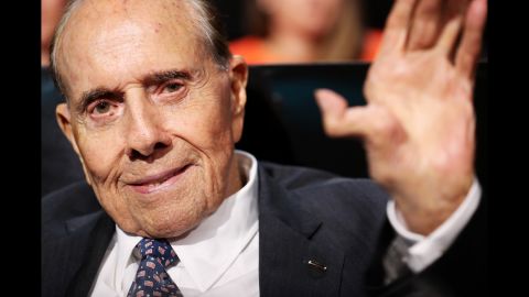 Former U.S. Sen. Bob Dole, the GOP's presidential nominee in 1996, waves after listening to a speech on Monday.